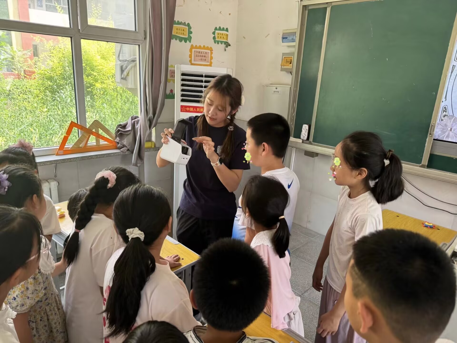 A presenter sharing learning materials with students beside their desks
