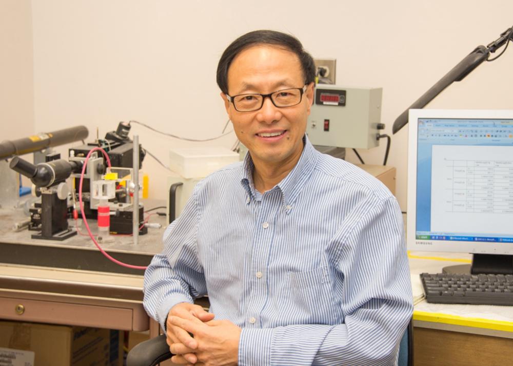 Professor X. Chris Le in a laboratory