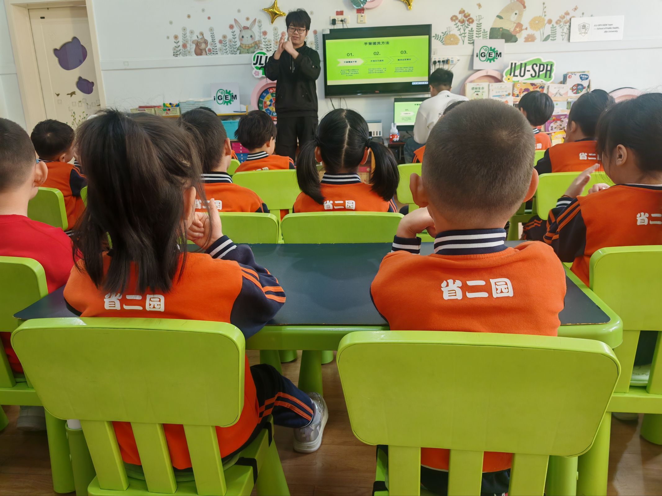 Children following the handwashing lesson