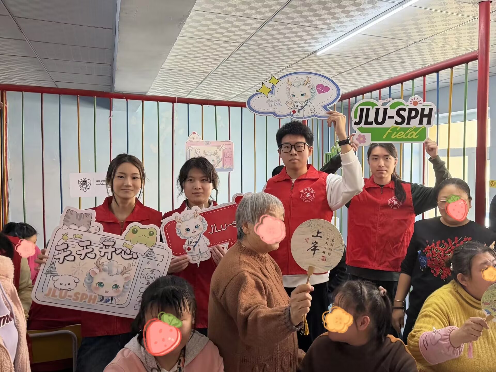 Participants and volunteers displaying fans and outreach boards