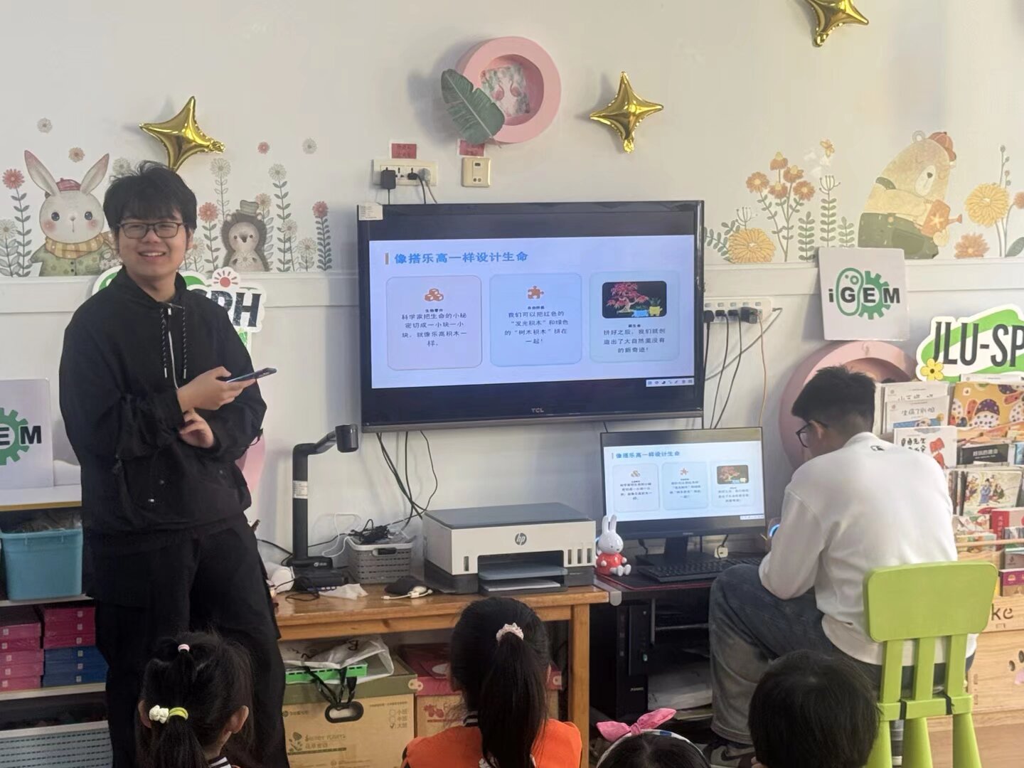 A presenter introducing DNA with illustrated slides