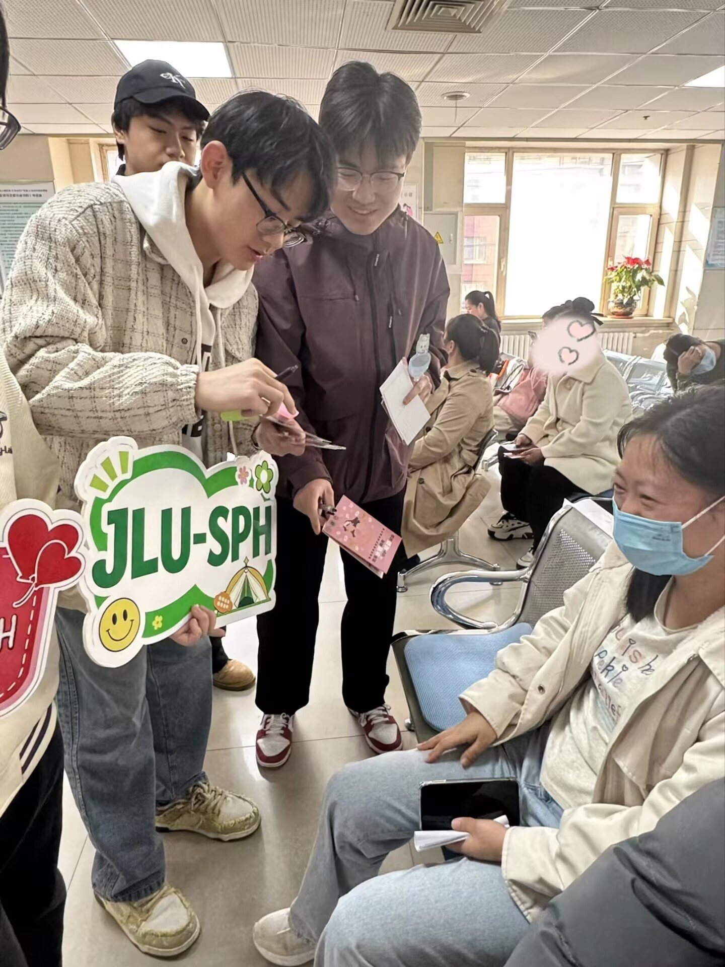 Team members offering information to seated visitors