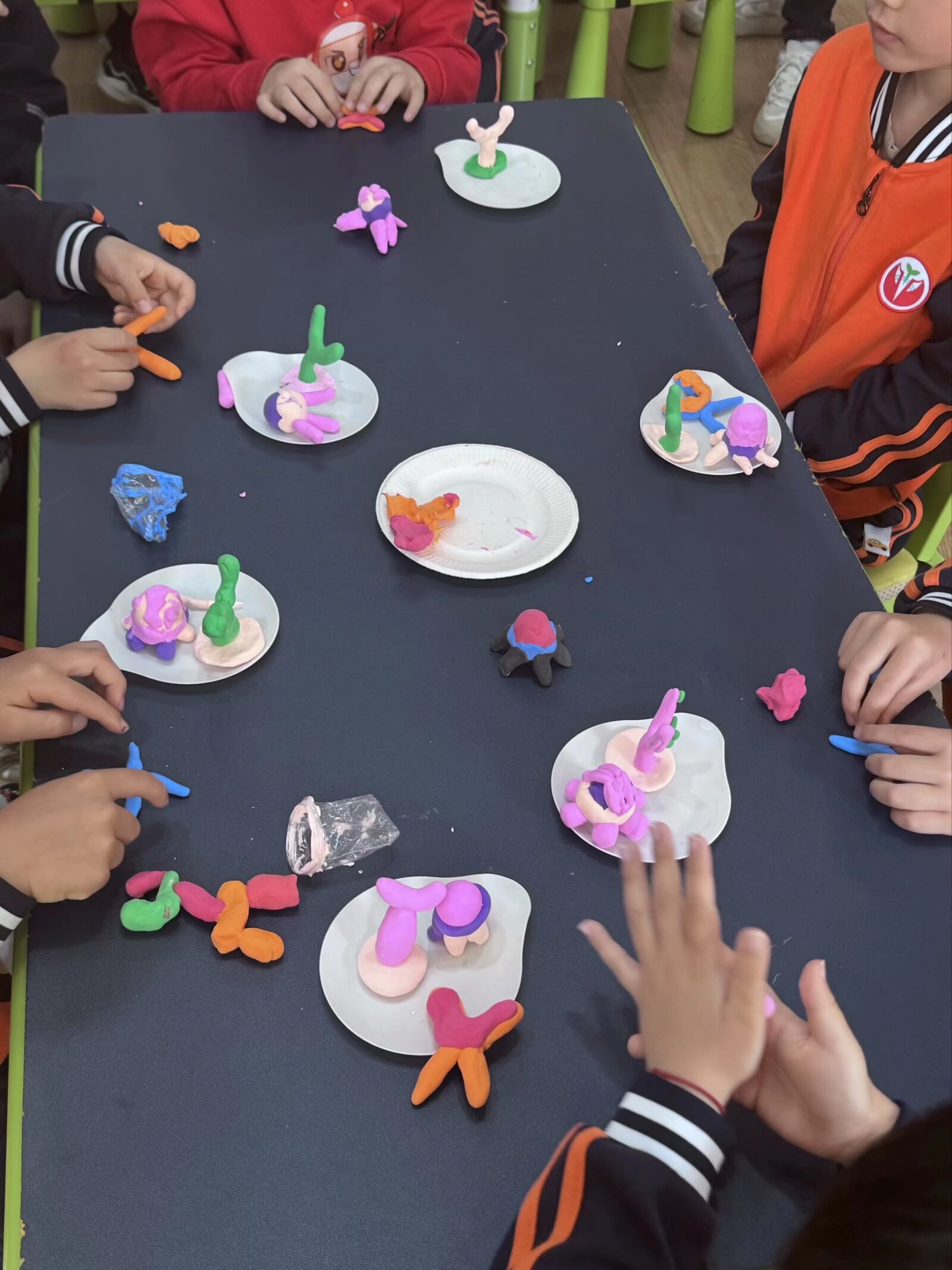 Colorful clay models made by children during the workshop