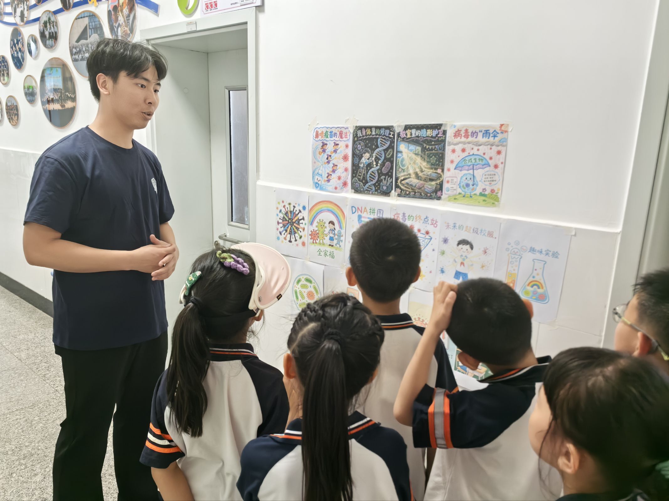 Children discussing posters during the school showcase